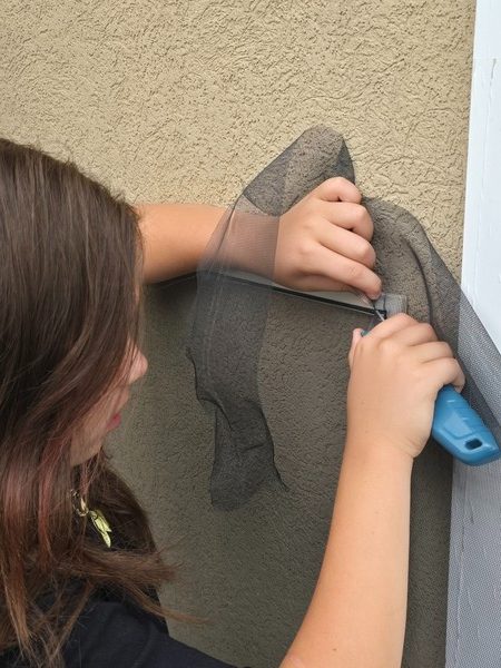 Carefully working the spline into the frame
